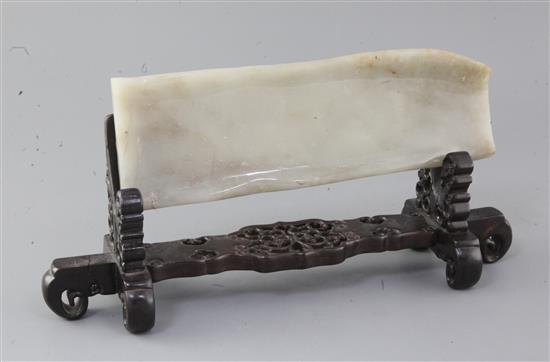 A Chinese pale grey jade plaque, 28.5 x 10cm excluding wood stand